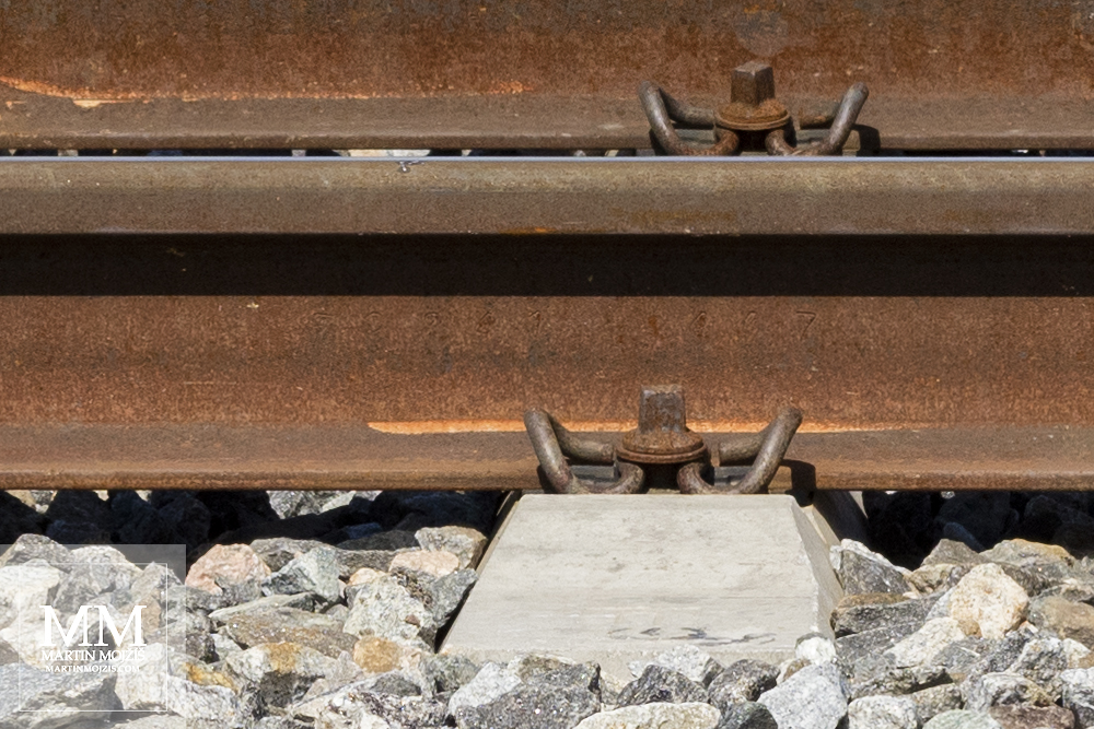Close-up view of a modern railway embankment. A photograph created with Canon EF 50 mm 1:1.8 STM lens.