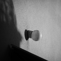 Lamp on a wall of a house. Title photograph of the gallery Diaries XXXVII.