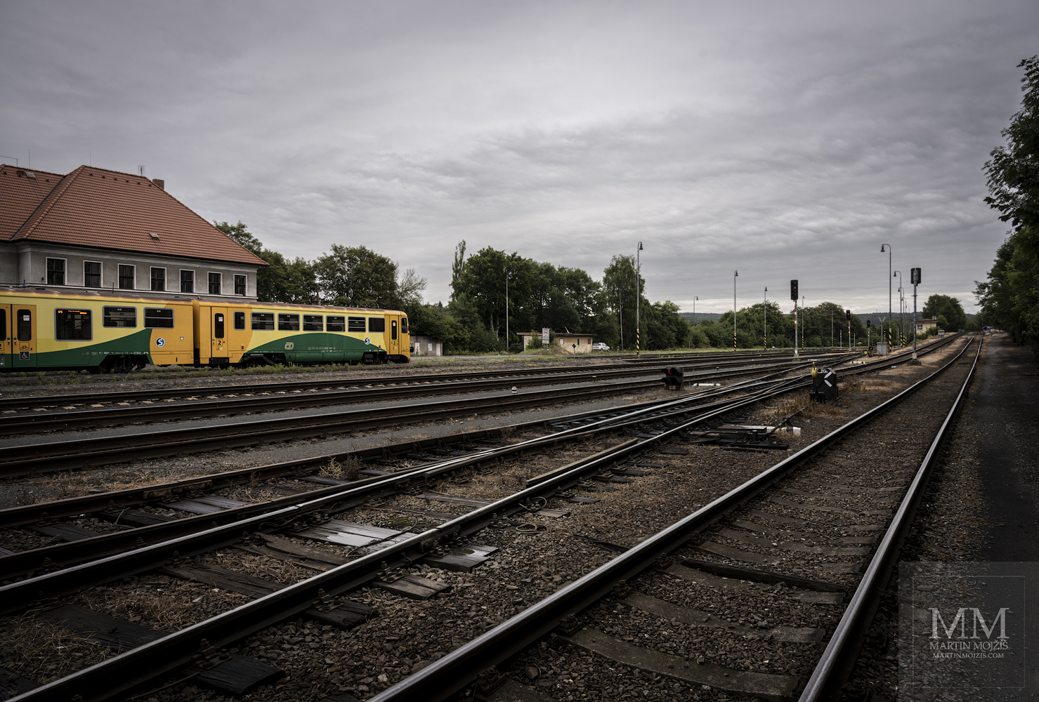 On the left is the post office building, on the right the tracks going up to the depot. Railway station Rakovnik.