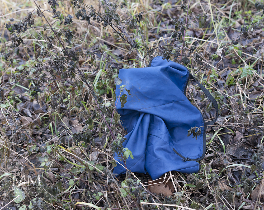 Blue fabric lying in the grass.