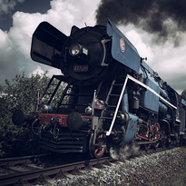 Dark blue steam locomotive.