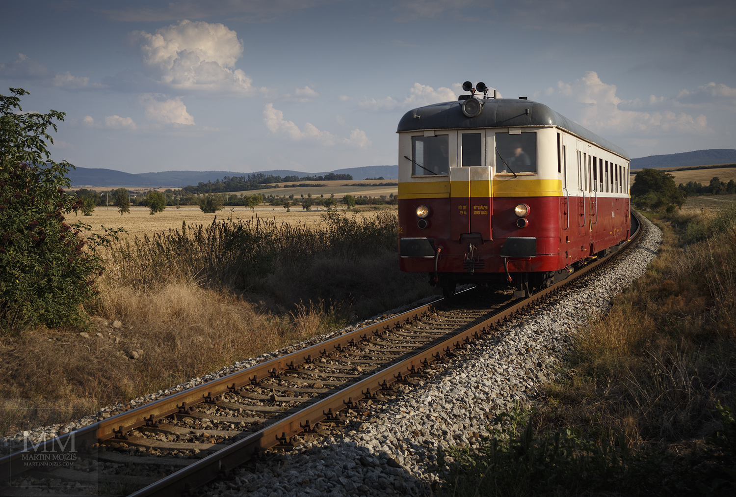 Large format, fine art photograph of yellow and red engine train. Martin Mojzis.