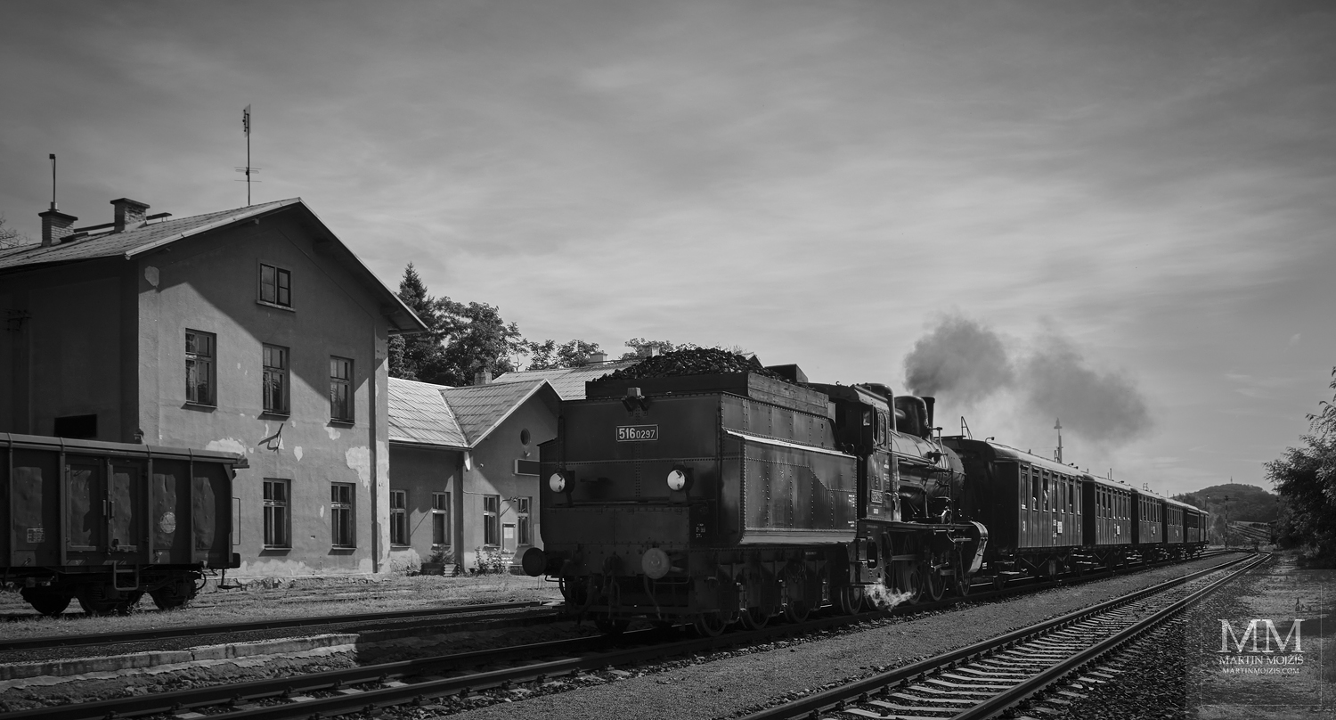 A steam train arrives at the station tender first. Fine art photograph IN THE STATION, photographed by Martin Mojzis.