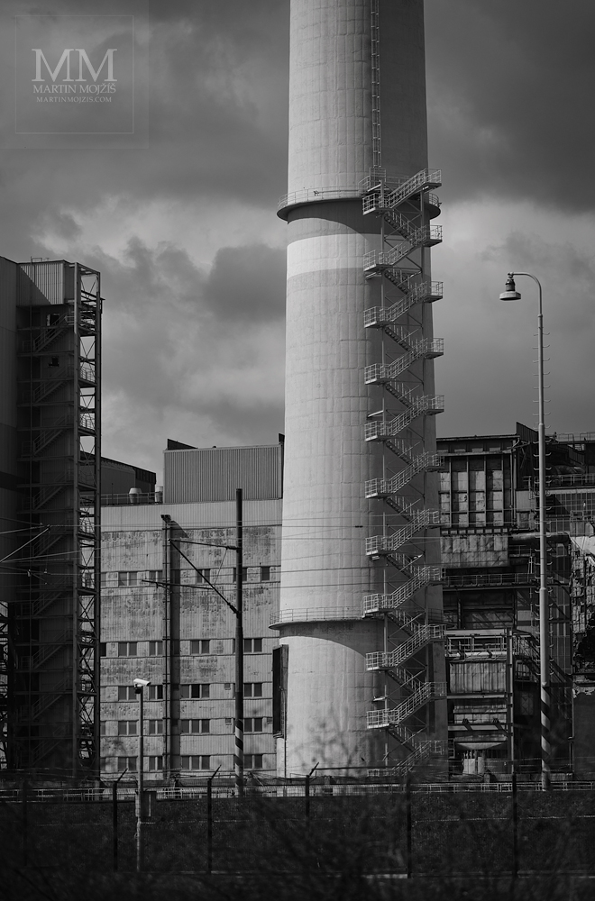 Stairs by the tall chimney of the power plant Prunerov I, now demolished. Fine art black and white photograph STAIRS OF THE PAST III, photographed by Martin Mojzis.