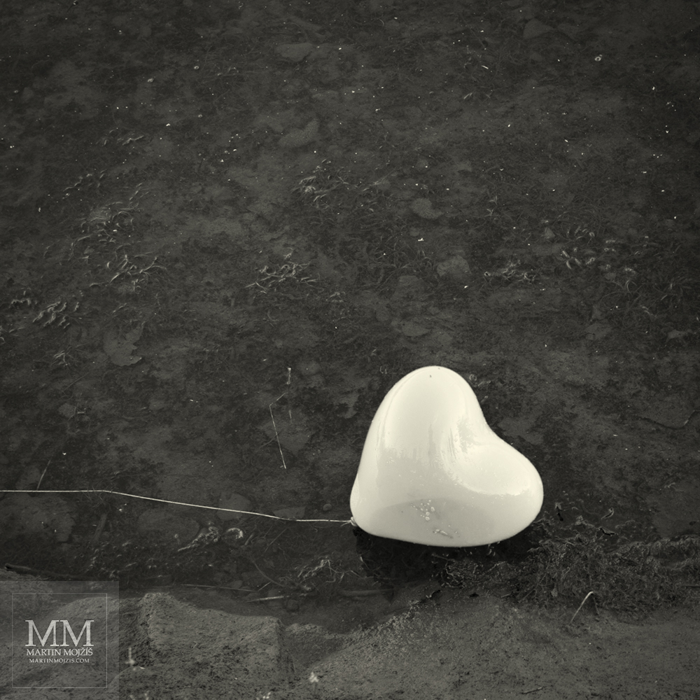 Heart shaped ballon. Photograph with title HEAVINESS OF LIGHT ENDS.