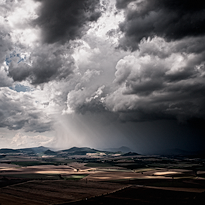 Photograph of storm clouds over the landscape. Introductory photograph by the gallery of large-format fine art photographs Different Landscapes by photographer Martin Mojzis.