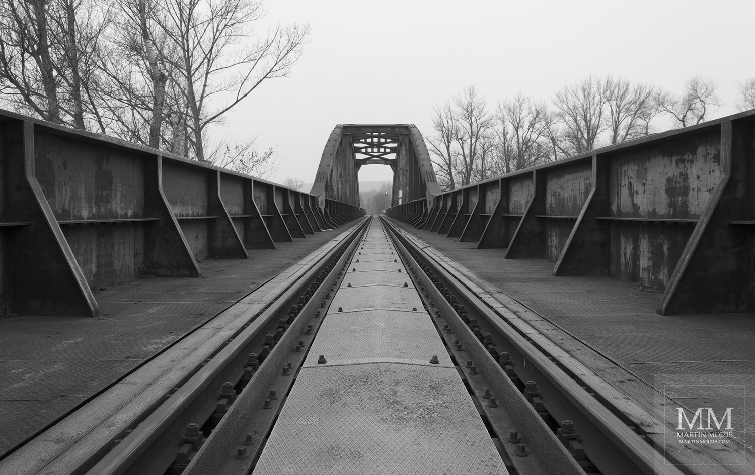 Massive railings of the steel railway bridge. Fine Art black and white photograph of Martin Mojzis with the title THROUGH SILENCE TO EVENING.
