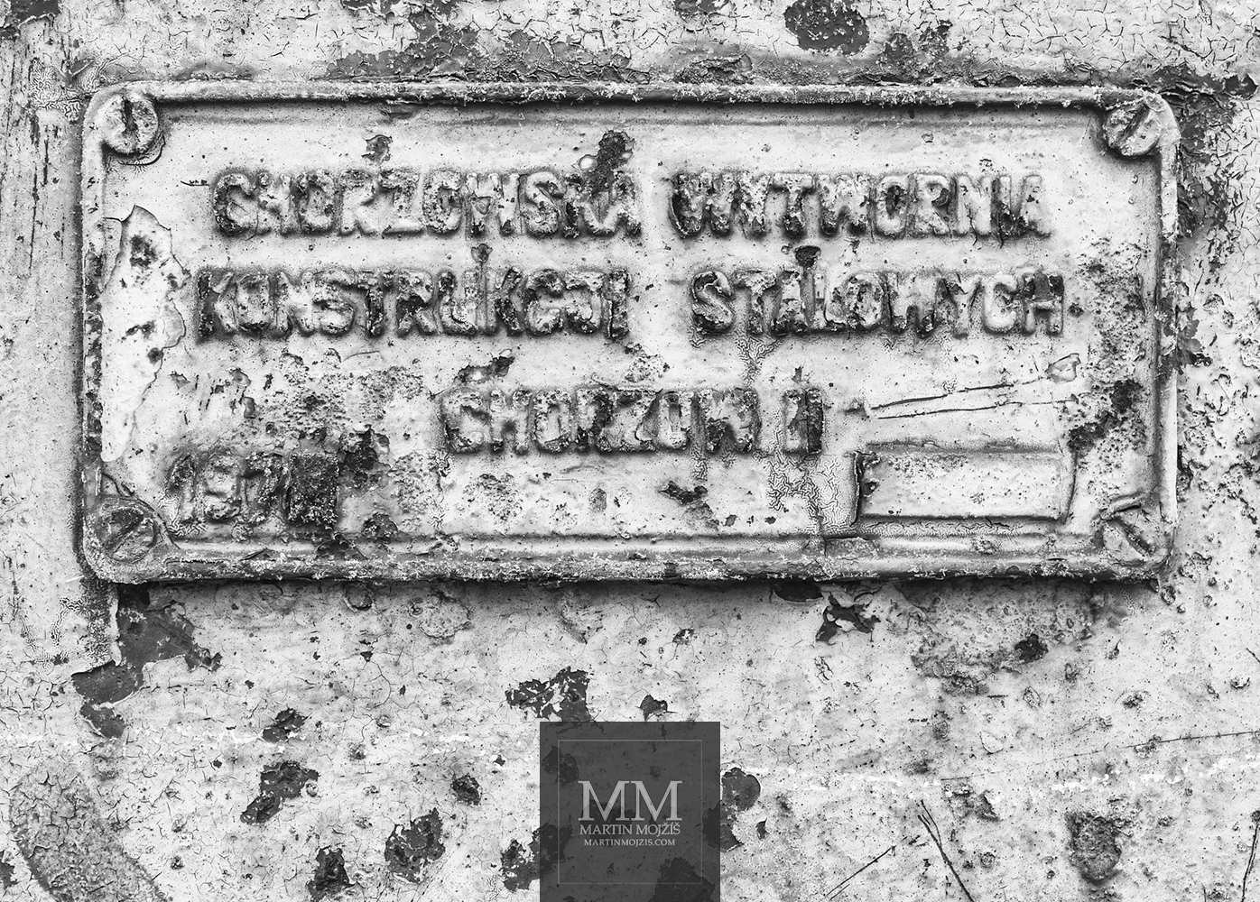 The label of the factory, that made the steel railway bridge. It states: CHORZOWSKA WYTWORNIA KOSTRUKCJI STALOWYCH CHORZOW II 1978.