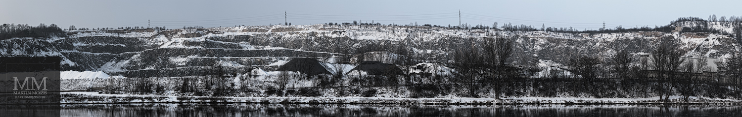 Large format, five meter (197 inches) wide photograph of the large, snow covered quarry by the river in winter. Fine Art large format photograph LANDSCAPE BY THE QUARRY ALTERED. Photographer Martin Mojzis.