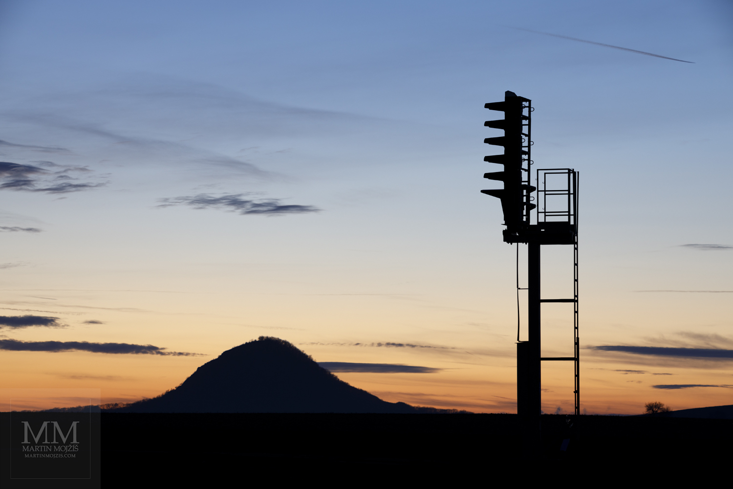 Large format fine art photograph of the vesper landscape and railway light signal appliance silhouette. Martin Mojzis.