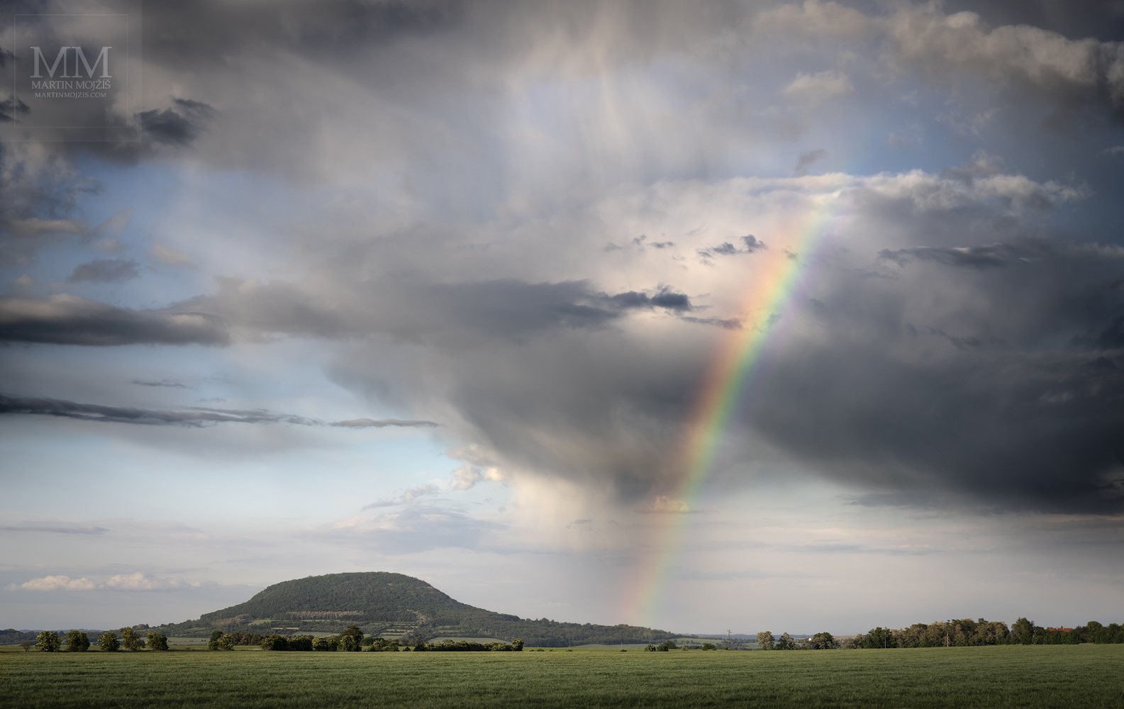 Rainbow close to Rip mountain. Fine Art large format landscape photograph SUN AND RAIN. Photographer Martin Mojzis.