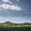 Large format fine art photograph of landscape with small hills and heaven.